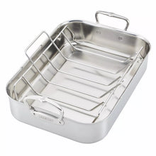 Stainless steel roasting pan with wire rack inserted, open interior and raised sides