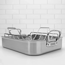 Stainless steel roasting pan with wire rack, long body and side grip handles