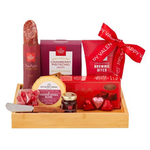 Valentine gift set tray with boxed sweets, chocolate bites, cheese, and red heart candies