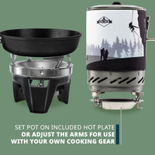 Outdoor stove with black burner and stainless steel pot and cooktop frame