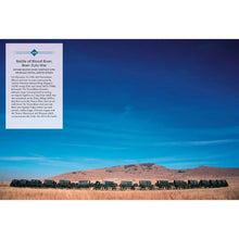 Hardcover history book page with text box and panoramic outdoor landscape
