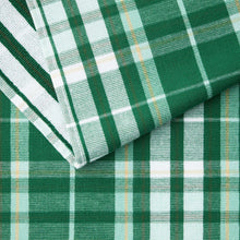 Green kitchen towel with white plaid pattern and stitched folded corner.