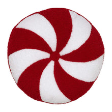 Holiday decorative pillow with red and white peppermint swirl design, round shape