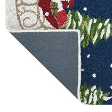 Hooked rug edge with textured off-white backing and blue-green holiday motif