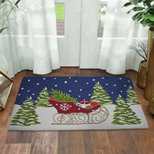 Holiday hooked accent rug with blue background, red sleigh and green pine trees