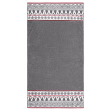 Bath towel with dark gray solid body and red/white patterned border at top and bottom