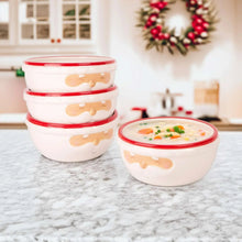 White Santa face bowls with red rims, one bowl filled with food