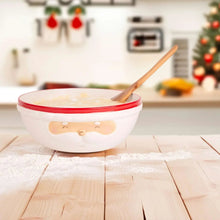 Santa face serving bowl with red rim, spoon resting on white contents