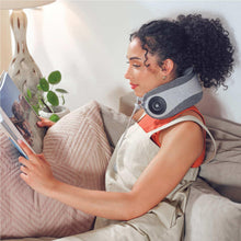 Portable neck massager with gray and orange-trim strap, round black control panel
