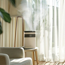Ultrasonic humidifier releasing visible mist next to indoor seating