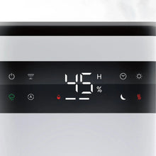 Ultrasonic humidifier control panel close-up with temperature and humidity icons