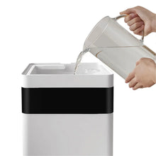 Ultrasonic humidifier with top fill opening and pouring water from clear jug