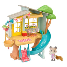 Treehouse dollhouse with yellow house, teal spiral slide, green roof, patio accessories