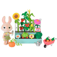 Garden playset with bunny figure, wheelbarrow, watering can, and colorful vegetable pieces