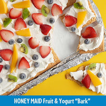 Graham cracker bark topped with white yogurt and fruit pieces