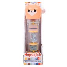 Fox rainstick rattle toy with orange fox head, clear tube, and stacked pieces in box