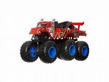 Monster truck toy with red cab, black body, and four oversized blue wheels