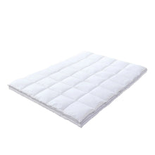 White quilted feather bed topper with baffle stitching