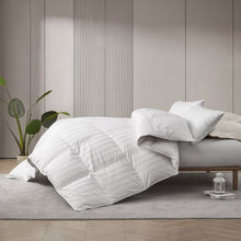 White down comforter folded, showing channel quilting