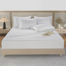 White cotton sheet set with fitted sheet and pillowcases, neatly arranged on a bed