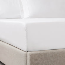 White fitted sheet corner with elastic seam detail
