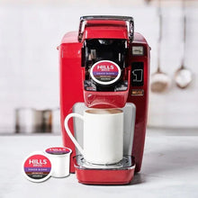 Red Keurig coffee maker with cup and K-Cup® pods