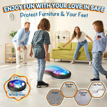 Indoor/outdoor hover soccer ball with glowing LED light on floor near children