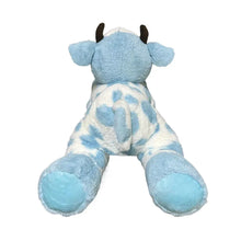 Blue cow plush in white patterned body, standing back view with small dark horns