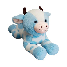 Blue and white cow plush with floppy ears, black eyes, and stitched smile