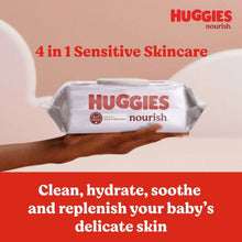 Baby wipes pack held in hand, Huggies nourish, 4-in-1 sensitive skincare