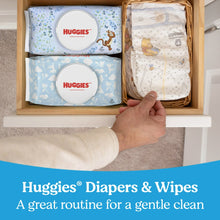 Baby wipes storage scene with two Huggies flip-top packs in a basket