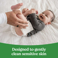 Baby getting cleaned with Huggies Natural Care sensitive baby wipes