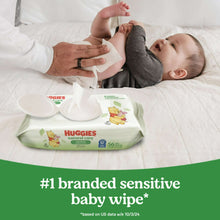 Baby being wiped with Huggies Natural Care sensitive baby wipes on a changing pad