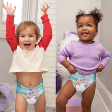 Unisex training pants on toddlers, green patterned pull-up style with cartoon print