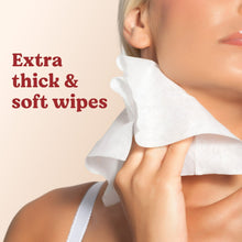 Extra thick and soft baby wipes held to an infant’s cheek