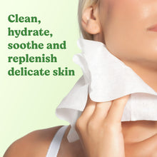 Huggies wipes used on a child's cheek with a white wipe