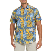 Men's short-sleeve woven shirt with blue tropical leaf print, button front, curved hem