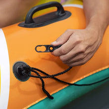 Inflatable island valve with rope tether on orange and teal striped surface
