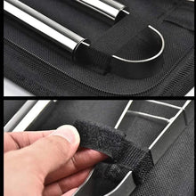 Black nylon grill tool case with metal rods and Velcro strap closure