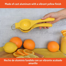 Yellow cast aluminum lemon squeezer with long handle and straining cup