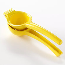 Yellow lemon squeezer with long handles and built-in pressing cup