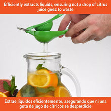 Green lime squeezer held over a glass jar, with juice dripping from the cone