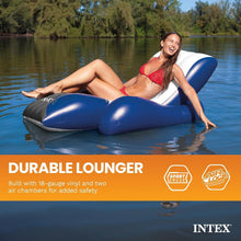 INTEX navy and white inflatable pool recliner floating with a woman relaxing