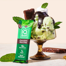 IQBAR protein bar in chocolate mint chip flavor beside mint ice cream scoop