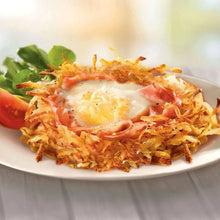 Plate of shredded hash browns with fried egg and green garnish