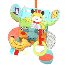Plush activity cube with bee face, fabric wings, banana and leaf textures, hanging rings