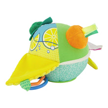 Soft sensory ball with green fabric, lemon slice panel, orange plush topper, and ribbon tags