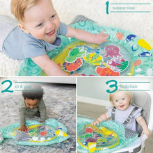 Baby on a narwhal-shaped teal tummy time play mat with sea animal toy graphics