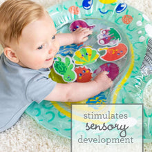 Close-up of teal narwhal play mat window with colorful sea animal illustrations
