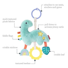 Teal plush dinosaur toy with star details, crinkle leaf, and teether parts on strings.